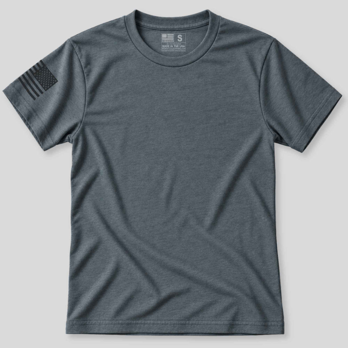 A dark heather gray crewneck t-shirt with a black distressed American flag graphic on the right sleeve, displayed flat against a light gray background.