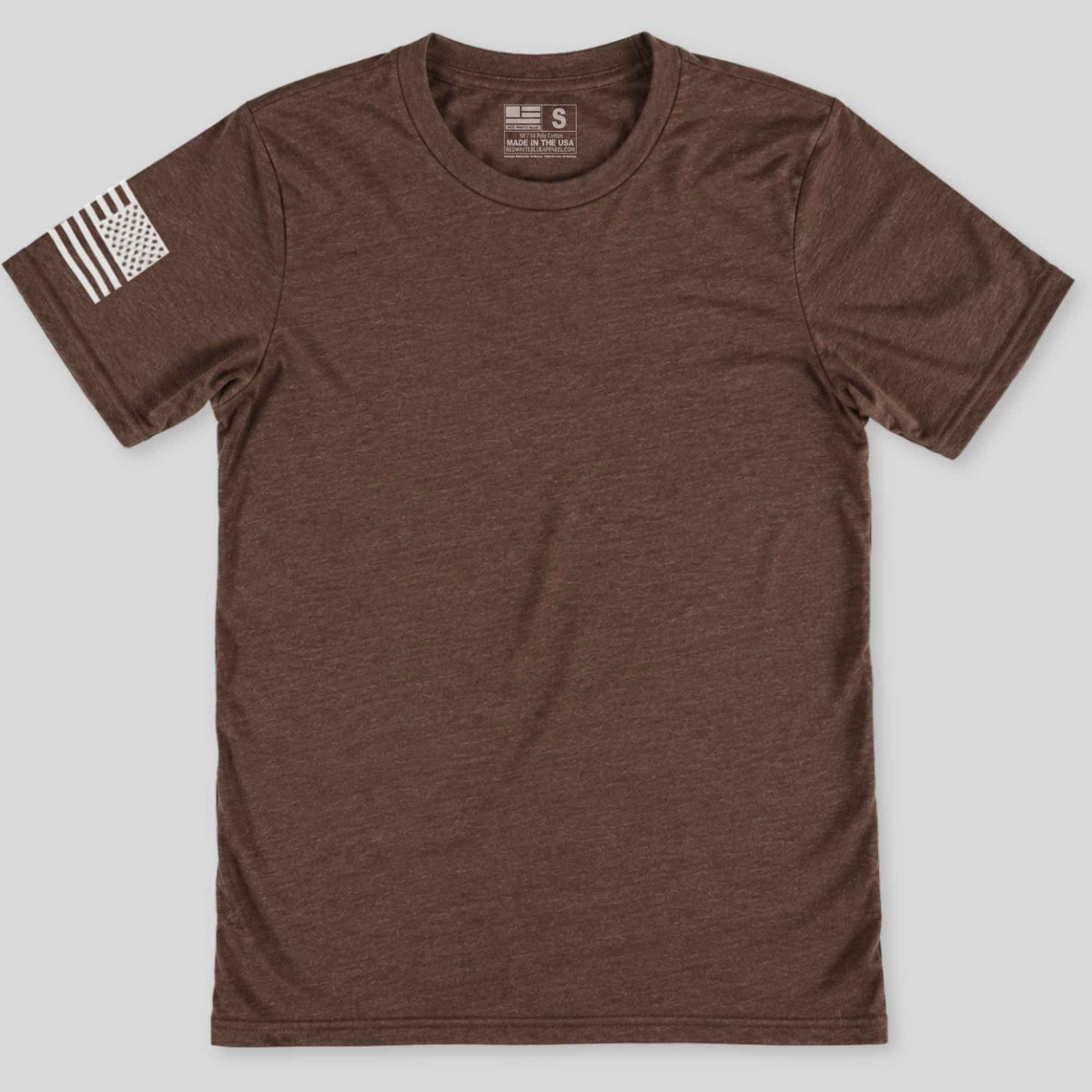 A brown short-sleeve crewneck t-shirt with a distressed black-and-white American flag graphic on the left sleeve, displayed flat against a light gray background.