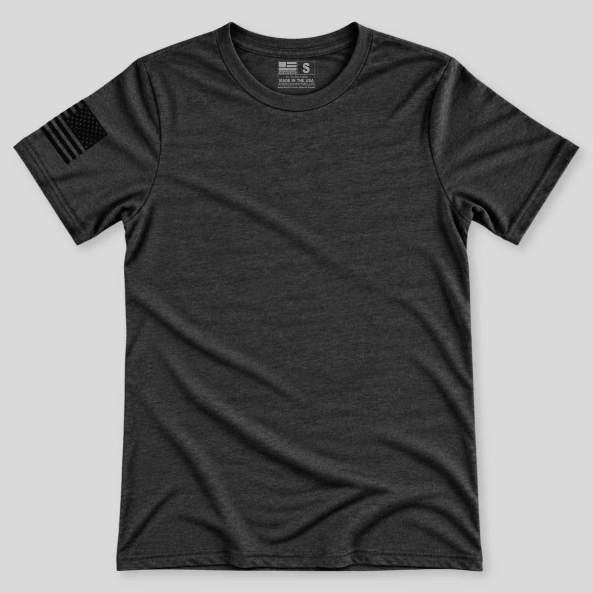 A dark charcoal gray heather crewneck t-shirt with a black distressed American flag printed on the right sleeve, displayed flat against a light gray background.