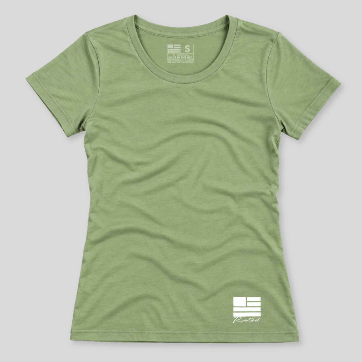 A women's short-sleeve crewneck t-shirt in heathered sage green, featuring a white graphic logo on the bottom right and a size/brand label on the inner neck, displayed against a neutral gray background.